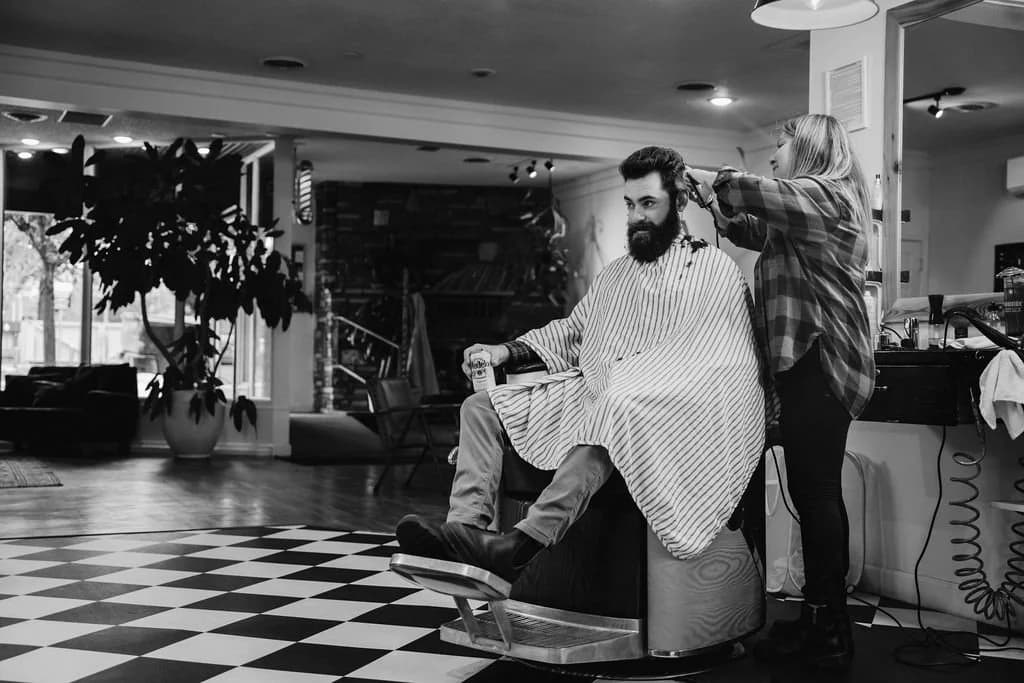 Barber at work inside Cropper & Co. Barbershop